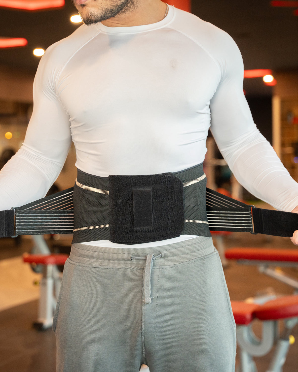 Man wearing the TheraCopper lower back brace over a shirt, front view