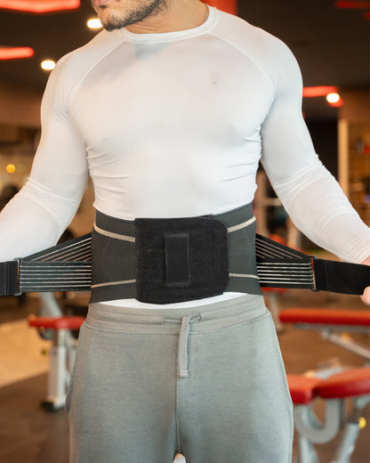 Man wearing the TheraCopper lower back brace over a shirt, front view