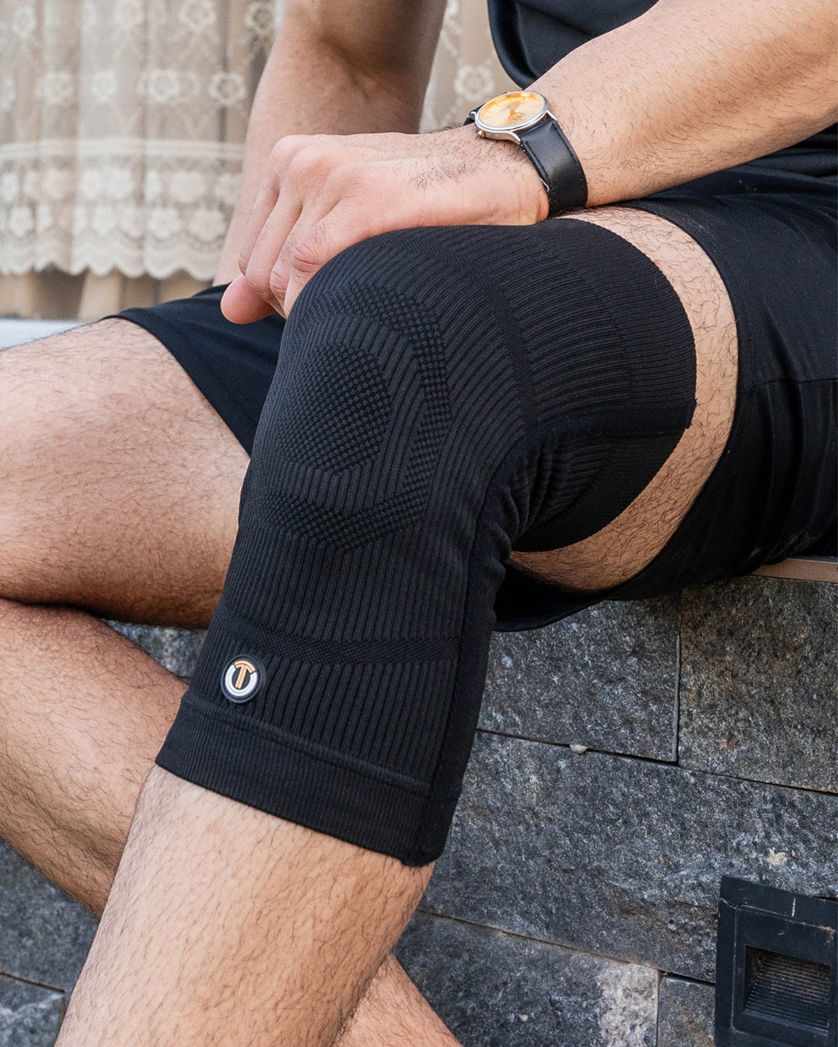 Close-up of a TheraCopper copper knee sleeve worn on the knee