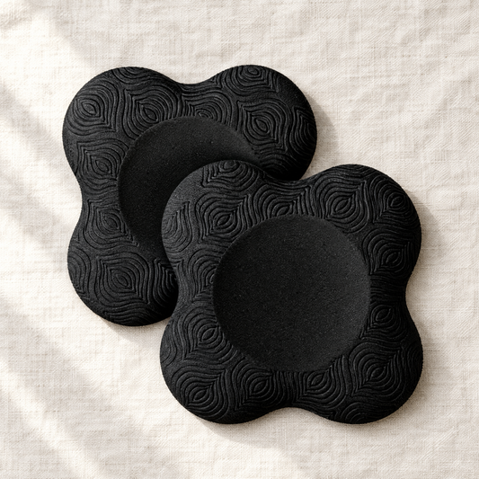 Pair of black clover-shaped cushioned knee pads